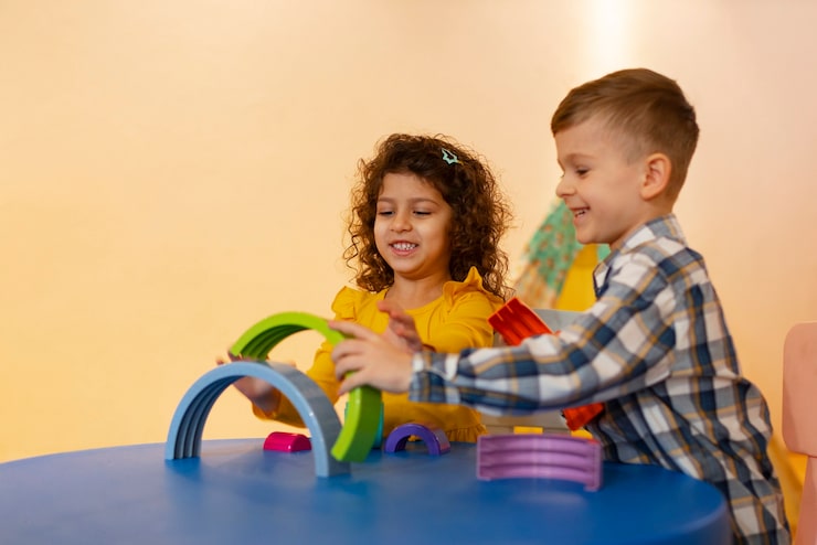 young-boy-girl-playing-indoors-with-eco-toys_23-2150268061
